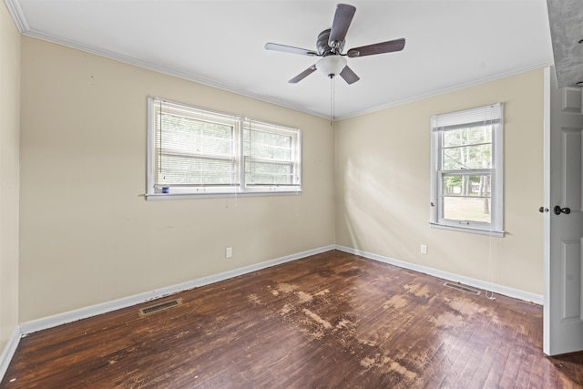  - spare room featuring wood-type flooring, a ceiling fan, and ornamental molding