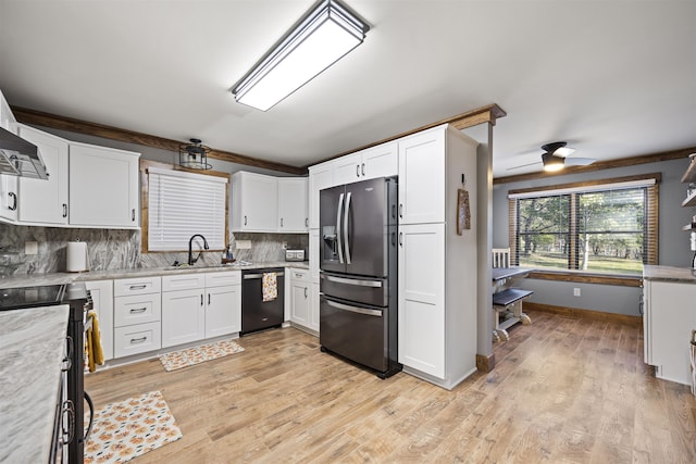 kitchen with refrigerator with ice dispenser, decorative backsplash, a sink, white cabinetry, and dishwashing machine