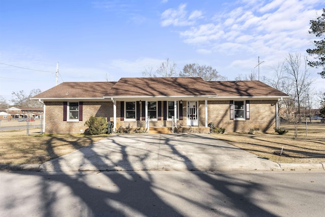 ranch-style house featuring covered porch