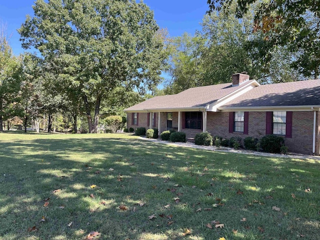 ranch-style house with a front lawn