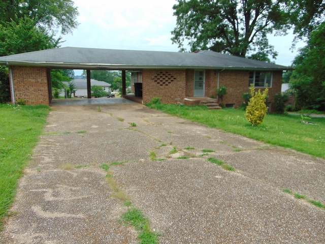 single story home featuring a carport and a front yard