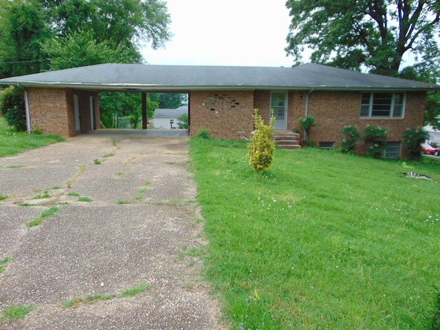 single story home with a front yard and a carport