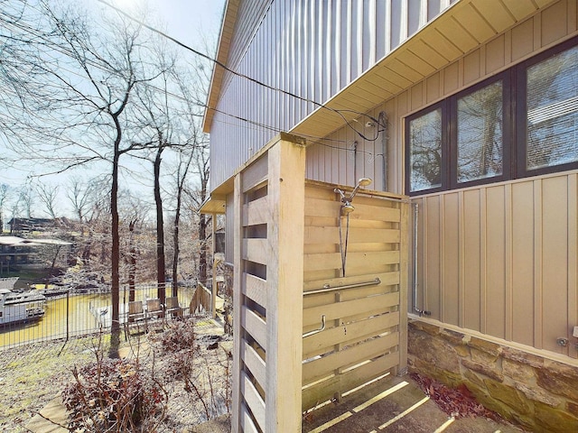 view of outbuilding with fence