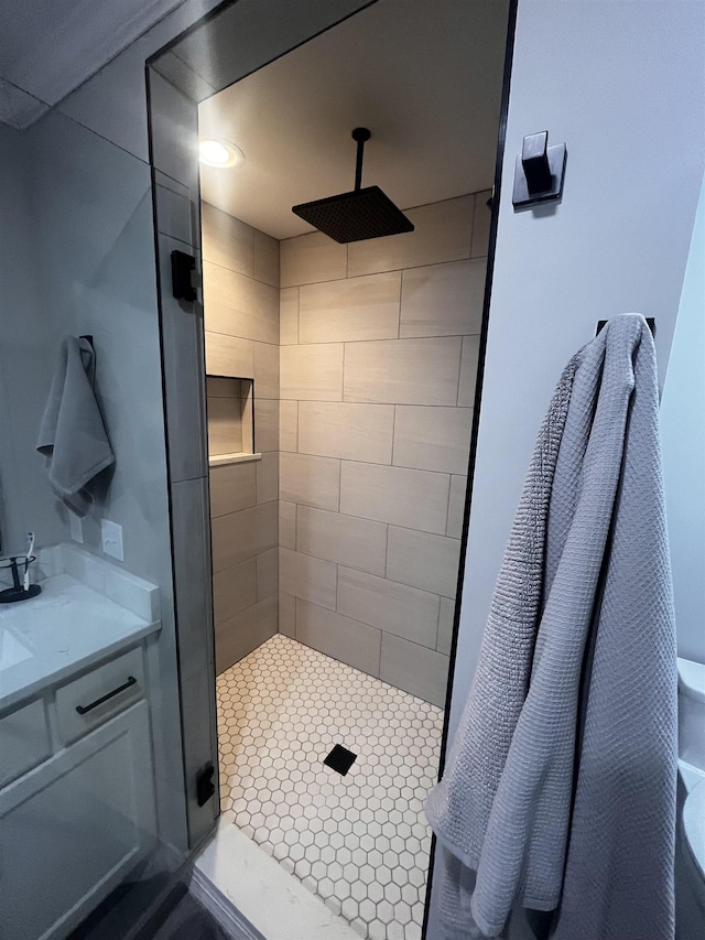 bathroom featuring a stall shower and vanity