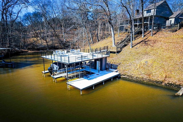 view of dock featuring a water view and boat lift