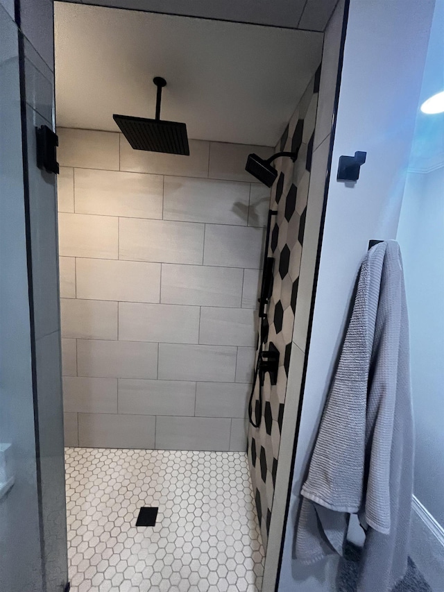 bathroom with tiled shower