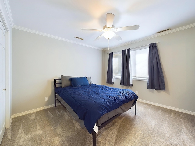 bedroom with baseboards, carpet, visible vents, and crown molding