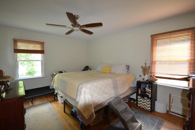 bedroom featuring light hardwood / wood-style floors and ceiling fan