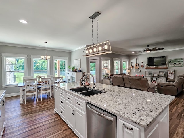 kitchen with dishwasher, a kitchen island with sink, ceiling fan with notable chandelier, sink, and white cabinetry