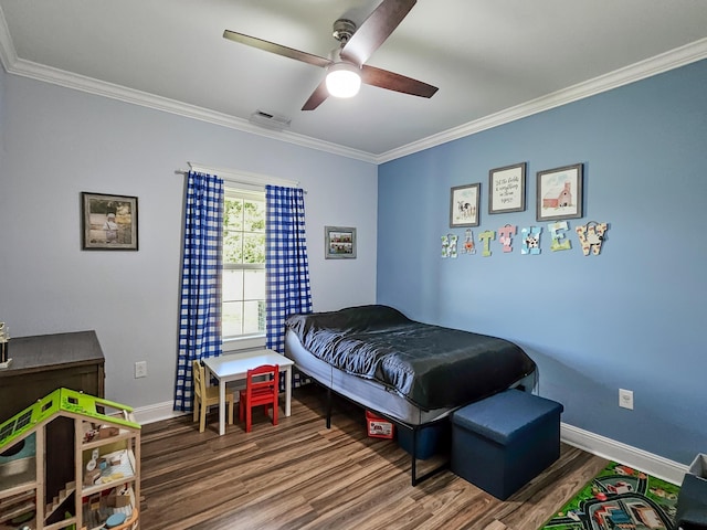bedroom featuring ceiling fan, wood-type flooring, and ornamental molding