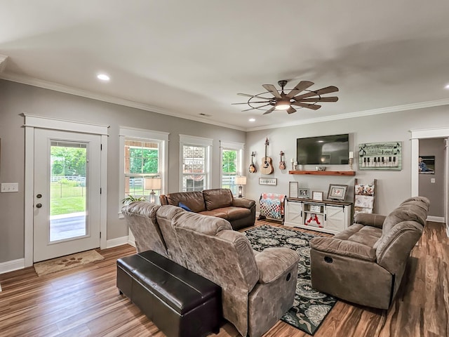 living room featuring ceiling fan, light hardwood / wood-style floors, and ornamental molding