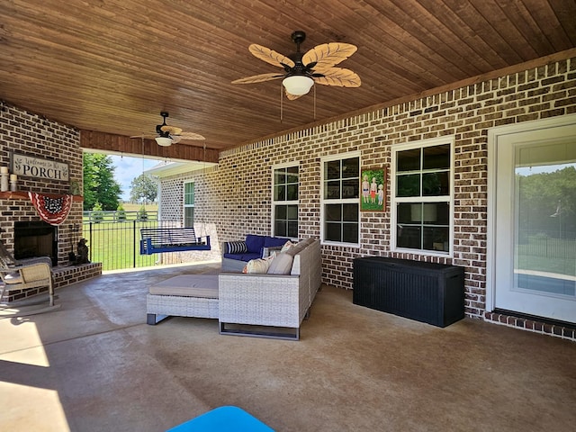 view of patio with outdoor lounge area and ceiling fan