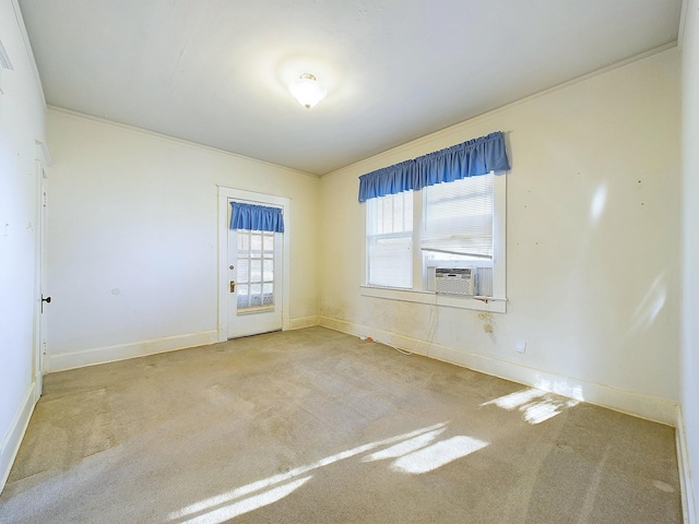 unfurnished room with cooling unit, crown molding, and carpet