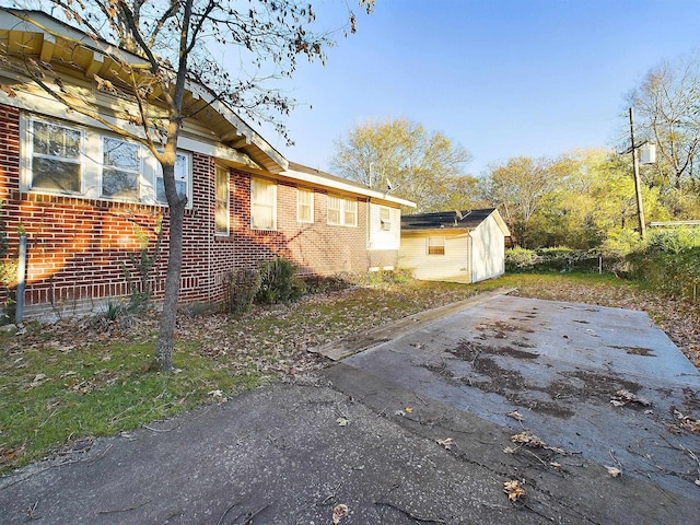 view of side of property with a patio