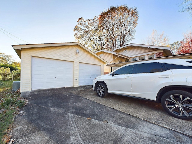 exterior space with a garage and an outdoor structure