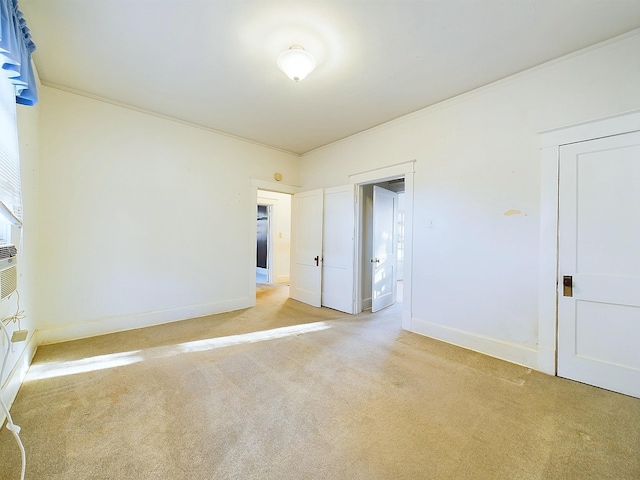 carpeted empty room with crown molding