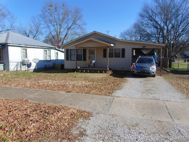 view of front of property with a carport and covered porch