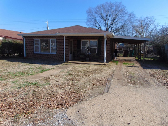 ranch-style house with a carport