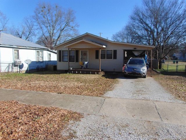 view of front facade featuring a porch and a carport