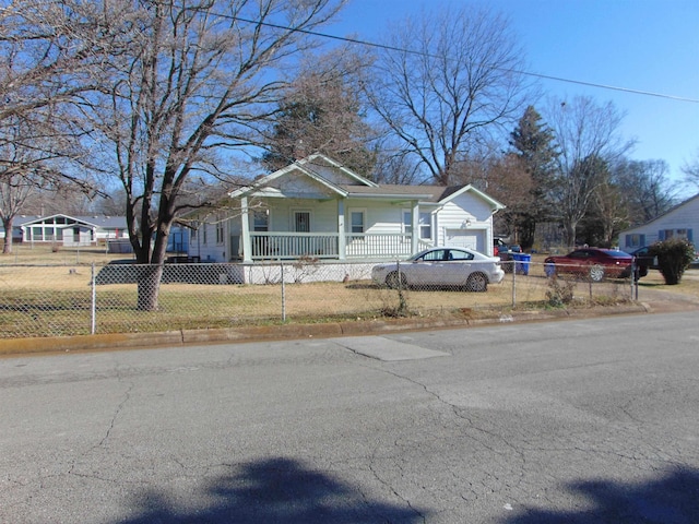 bungalow-style home featuring a porch and a garage