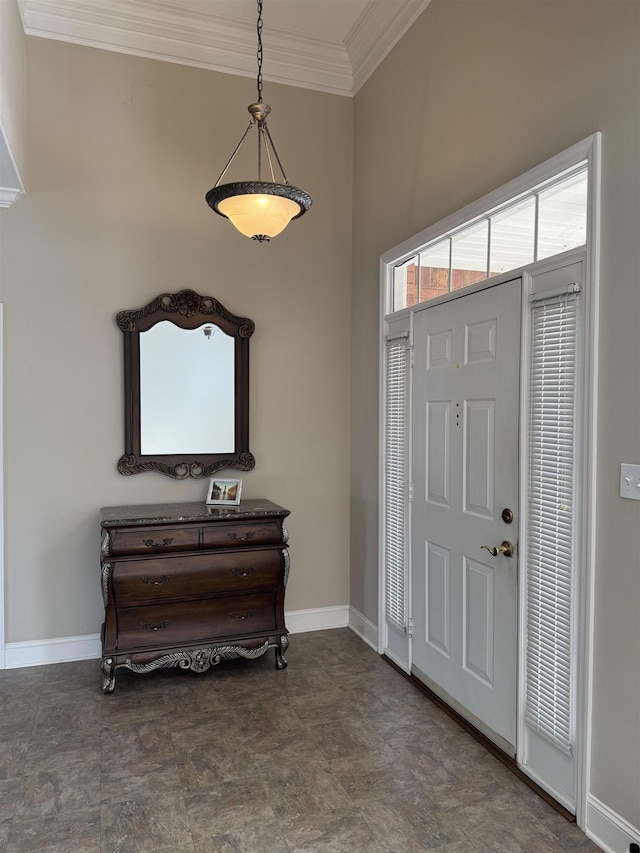 entrance foyer featuring crown molding and baseboards