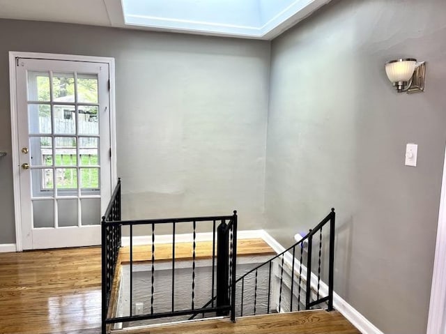  - staircase with wood finished floors