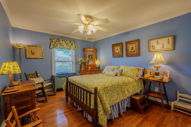 bedroom featuring hardwood / wood-style floors, ceiling fan, crown molding, and a textured ceiling