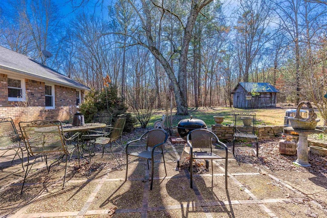 view of patio / terrace featuring a storage unit