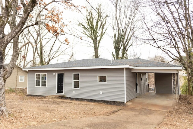 view of front of home featuring a carport