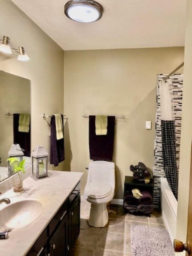 full bathroom with tile patterned flooring, vanity, toilet, and shower / tub combo