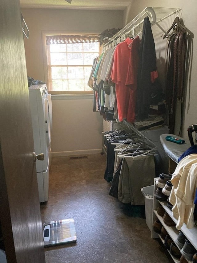 spacious closet with washing machine and dryer