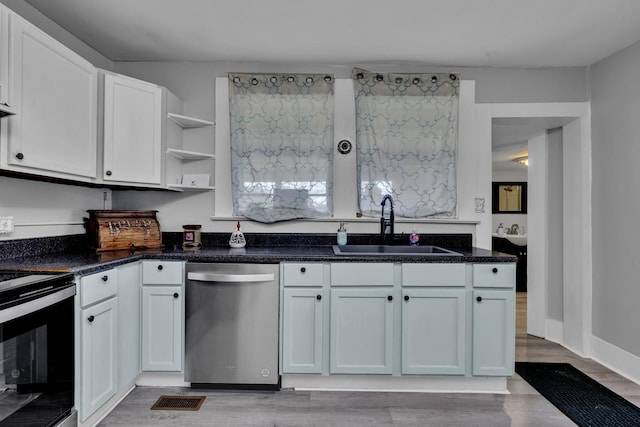  - kitchen with open shelves, a sink, dishwasher, electric range oven, and white cabinets