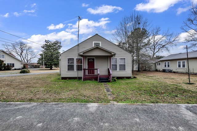  - bungalow-style house featuring a front yard