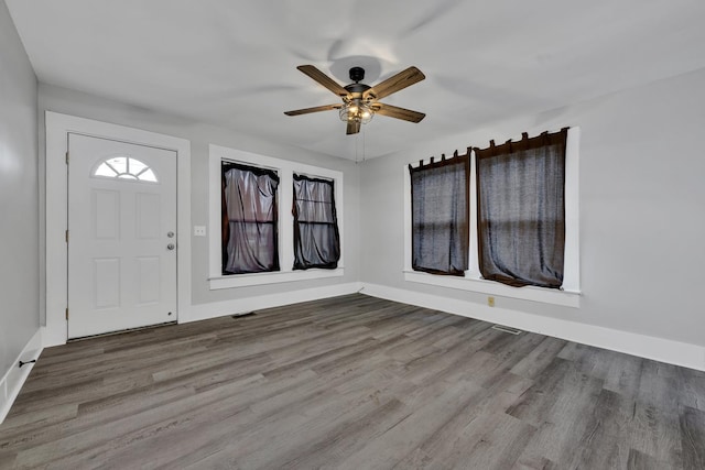  - entrance foyer with baseboards, wood finished floors, and ceiling fan