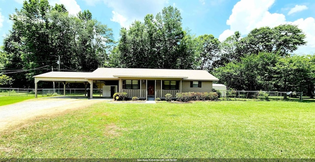 ranch-style house featuring a porch, a carport, and a front lawn