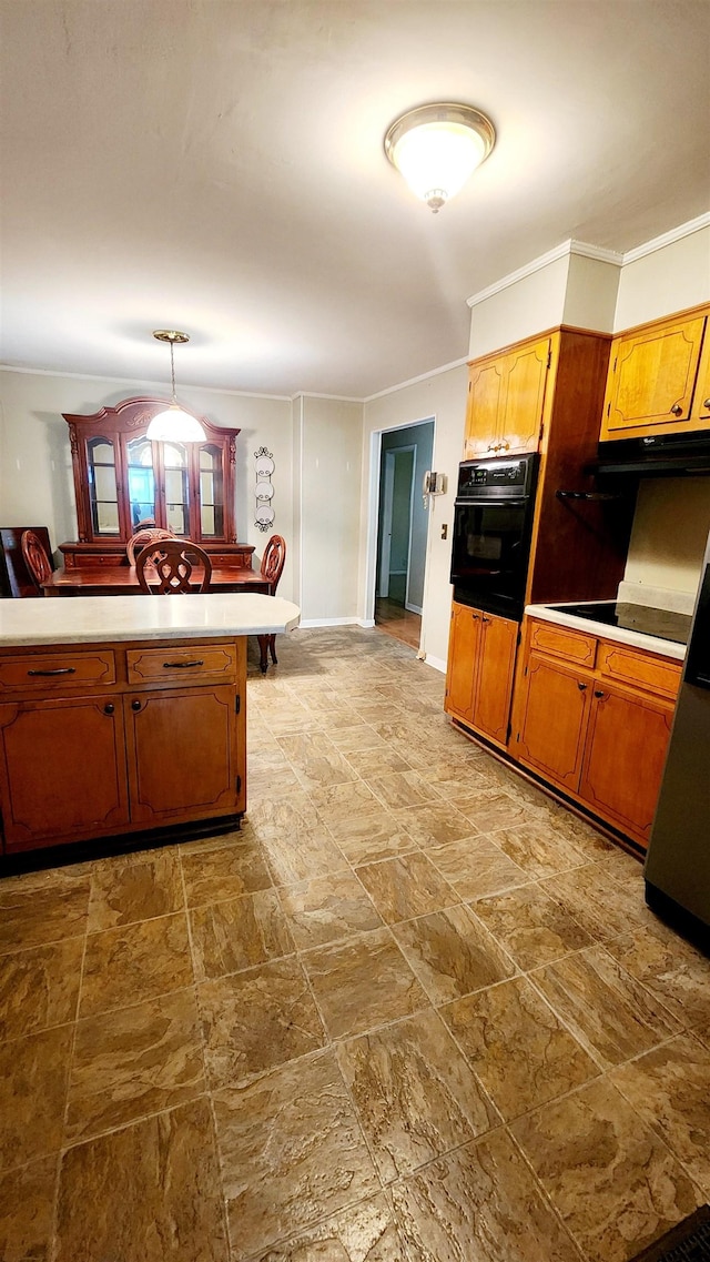 kitchen featuring cooktop, kitchen peninsula, decorative light fixtures, black oven, and ornamental molding