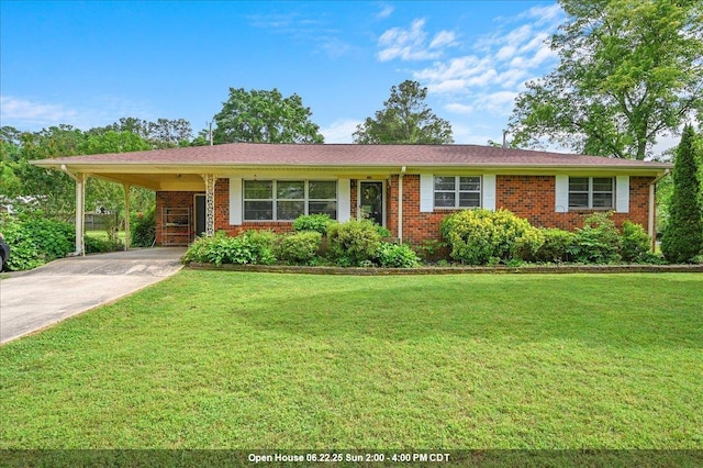  - single story home with a front lawn, brick siding, driveway, and an attached carport