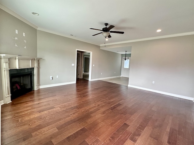  - unfurnished living room featuring a ceiling fan, a fireplace, crown molding, dark wood-style flooring, and baseboards