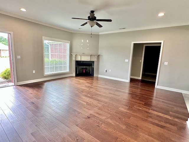  - unfurnished living room with healthy amount of natural light, a ceiling fan, baseboards, crown molding, and recessed lighting