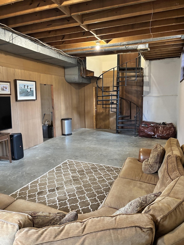 unfinished basement with wood walls and stairway