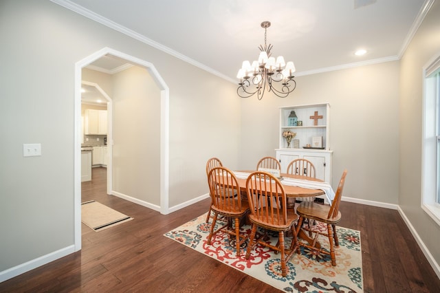 dining space with baseboards, arched walkways, dark wood-type flooring, and crown molding