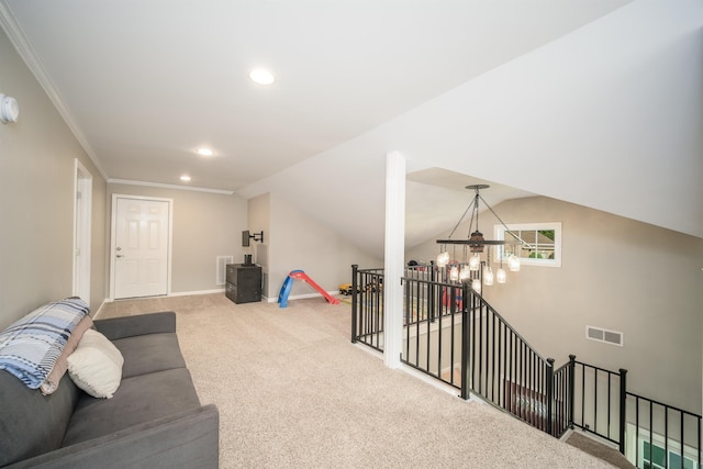 carpeted living area featuring visible vents, recessed lighting, crown molding, a chandelier, and vaulted ceiling