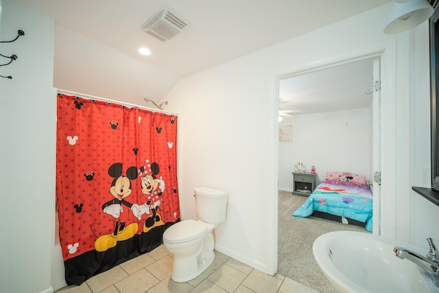 ensuite bathroom with tile patterned floors, visible vents, toilet, ensuite bathroom, and a sink