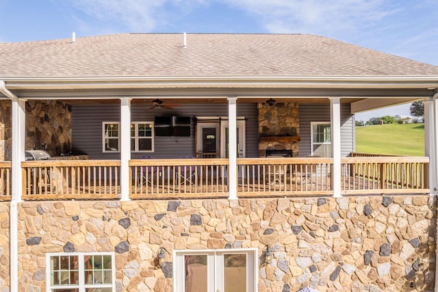 back of property featuring a shingled roof