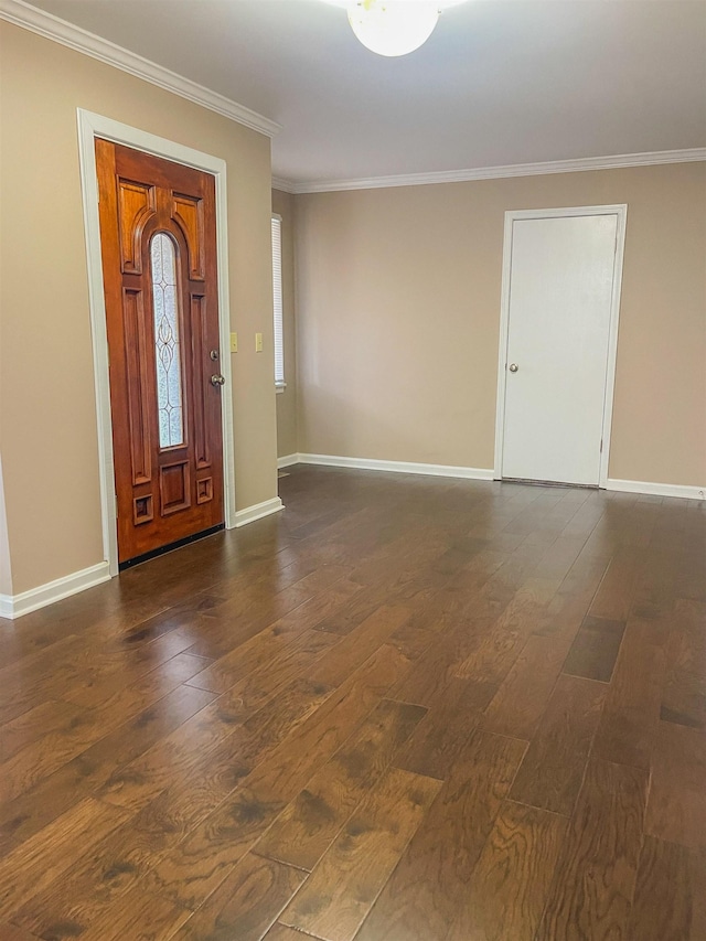 entrance foyer featuring dark hardwood / wood-style floors and ornamental molding