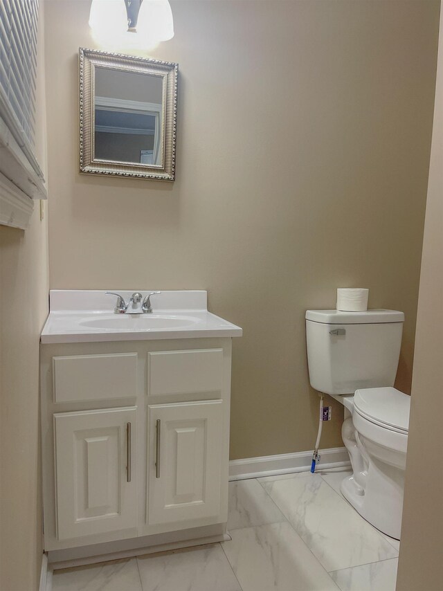 bathroom with vanity and toilet