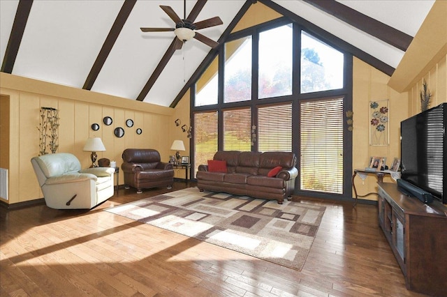  - living room with hardwood / wood-style floors, high vaulted ceiling, ceiling fan, and beam ceiling