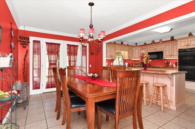  - dining room with light tile patterned floors, ornamental molding, french doors, and a notable chandelier