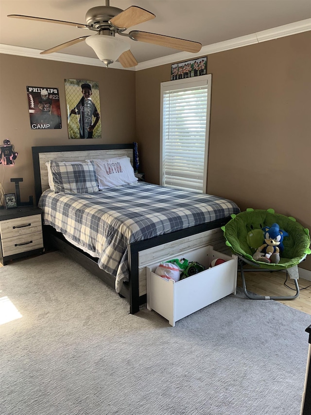 bedroom featuring crown molding and ceiling fan