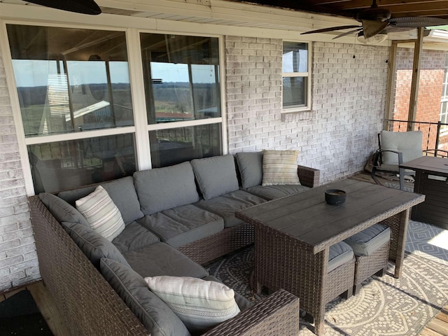 view of patio / terrace with a ceiling fan and an outdoor living space